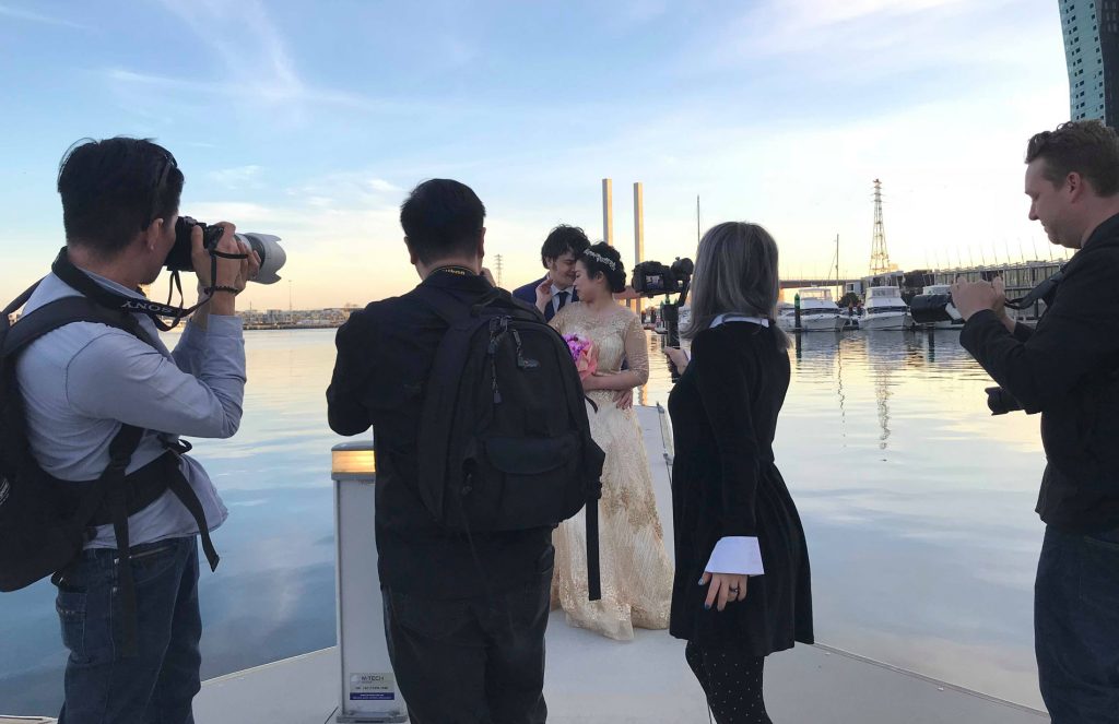 Behind the scene photo of Black Avenue Productions shooting a wedding photography and videography shoot in Docklands Melbourne 