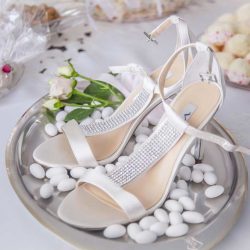 high heel shoes with sugar almonds as wedding reception decoration idea 2018