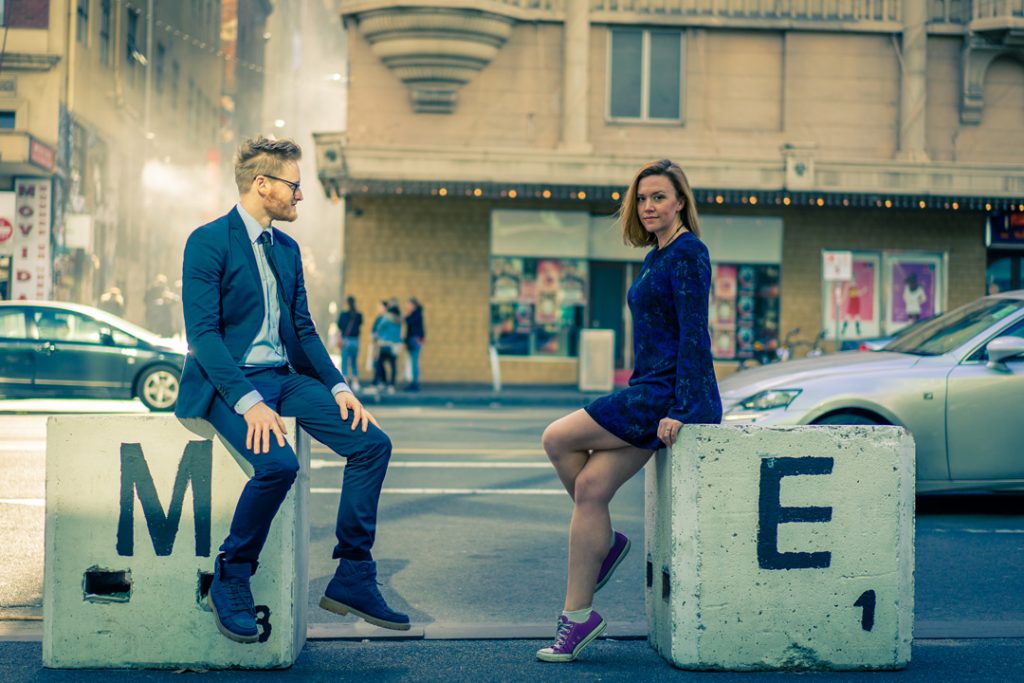Melbourne engaged couple sitting by MoVida for their engagement photo session