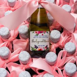 personalised wine bottles with pink ribbon for wedding