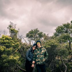 artistic modern couple photography showing lovers in casual attire walking through the woods in Australia Mornington peninsula