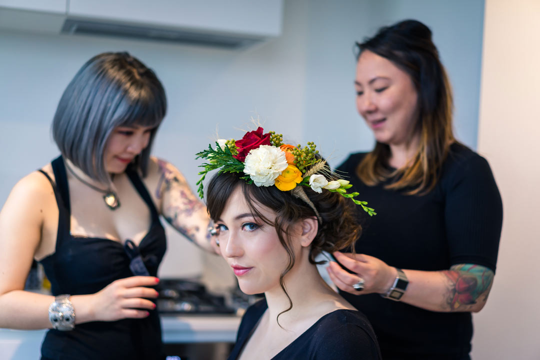 makeup artist Eileen Yan Z and destination wedding photographer Lowina Blackman behind the scene applying makeup to Melbourne bride for wedding shoot by Black Avenue Productions