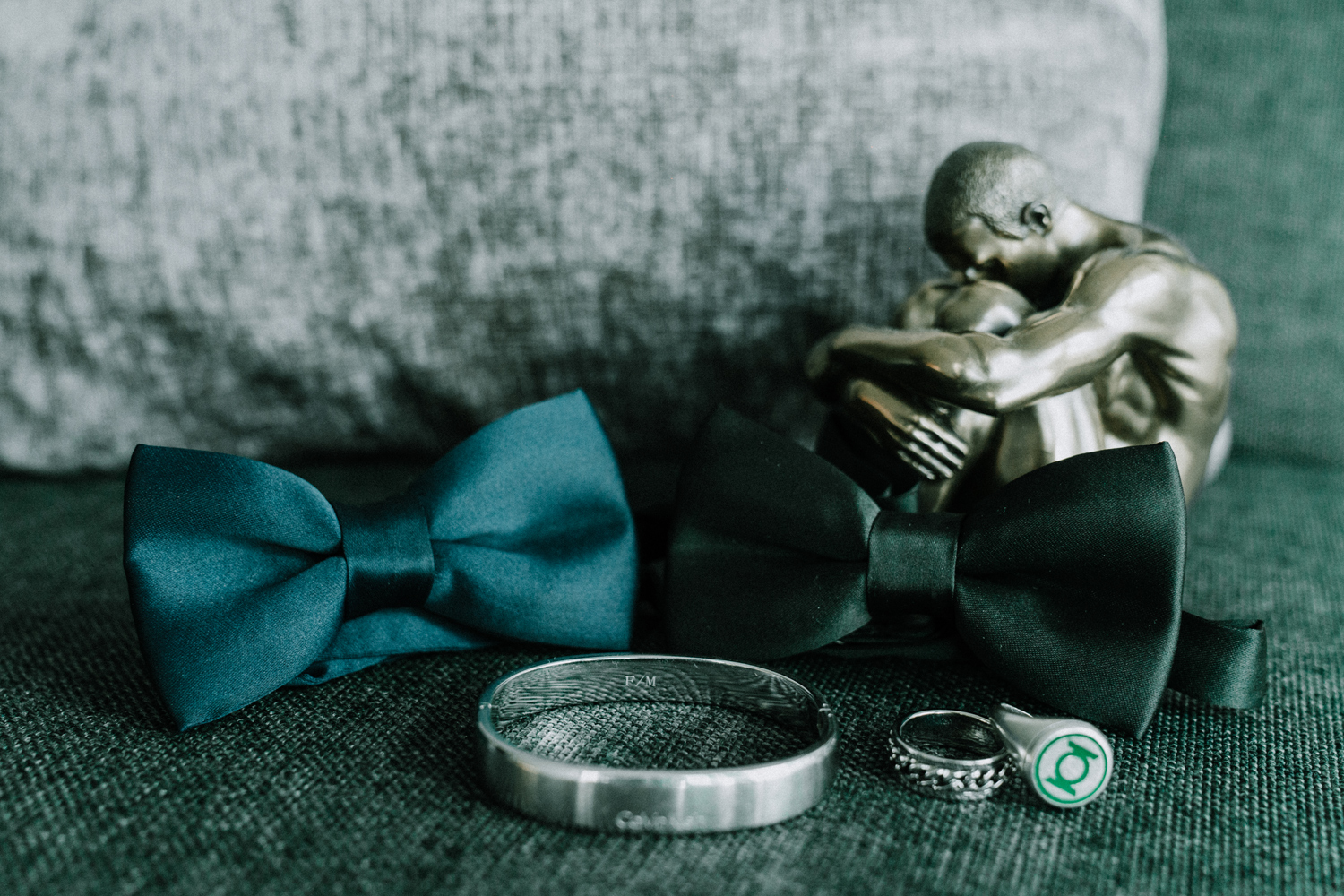 Gay wedding photo showing detail of bow ties and wedding rings