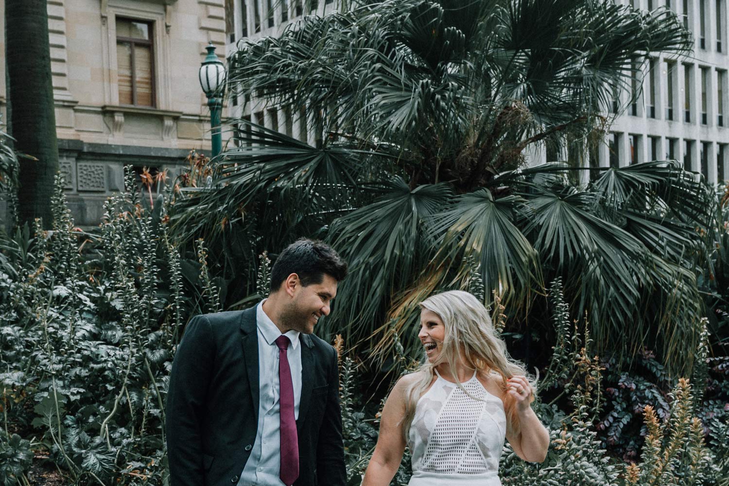 happy couple joking and laughing with each other moment captured by Melbourne wedding photographers Black Avenue Productions