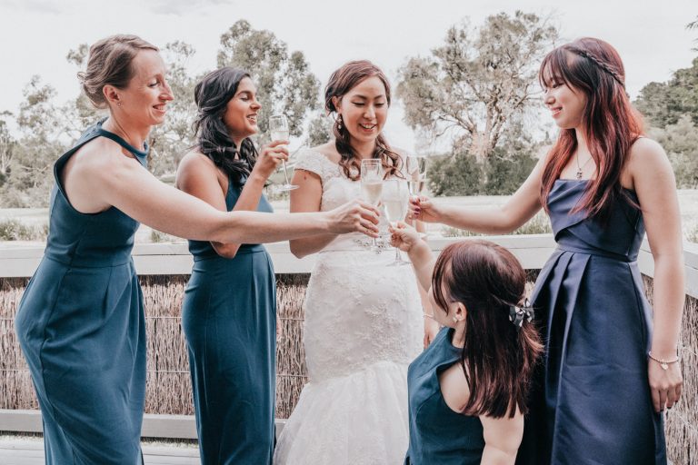 bride cheers champagne with her bridal party at Immerse Yarra Valley wedding reception