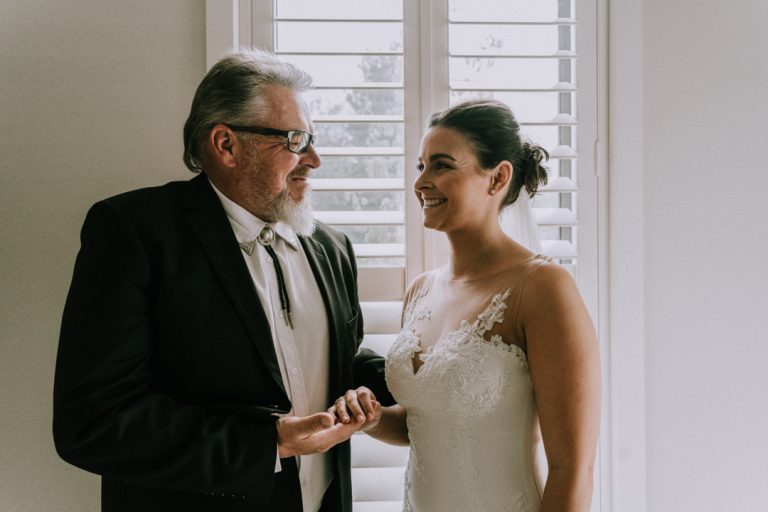 father of bride happily blessed his daughter before wedding ceremony