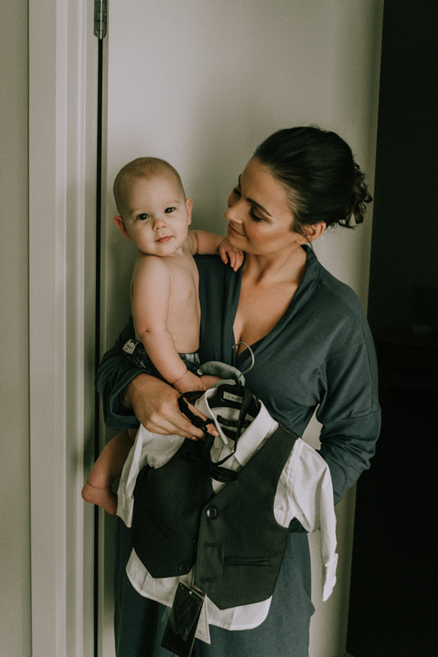 bride and baby getting ready for their boho wedding in Australia