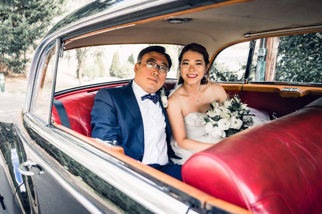 father and bride waiting inside classic vintage old wedding car from Triple R