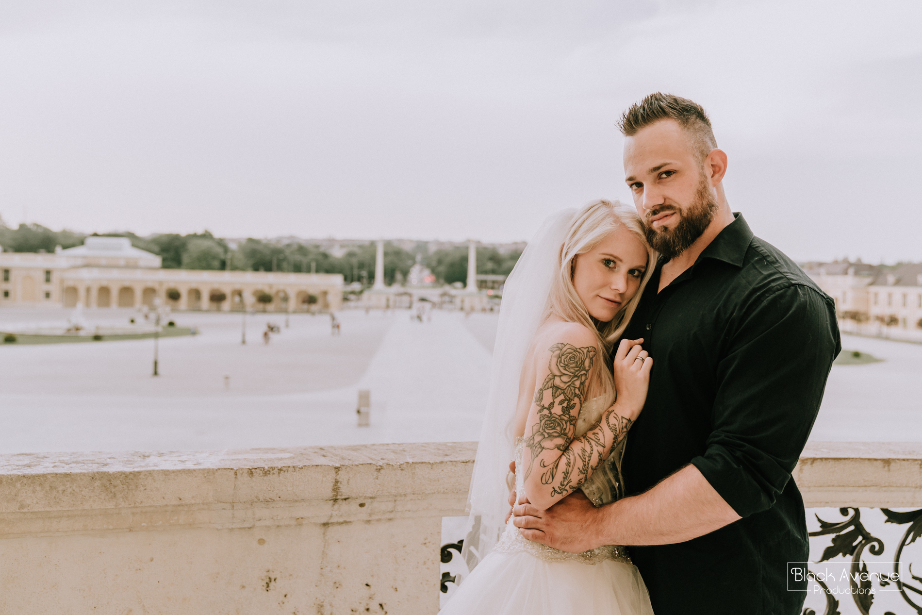 beautiful fitness bride and groom hug for their wedding photo in Belvedere Palace Vienna by destination wedding photographers from Black Avenue Productions