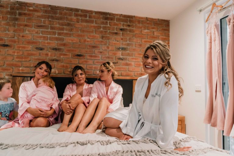 bride and bridesmaids getting ready in their Melbourne home captured by wedding photographer Derek from Black Avenue Productions