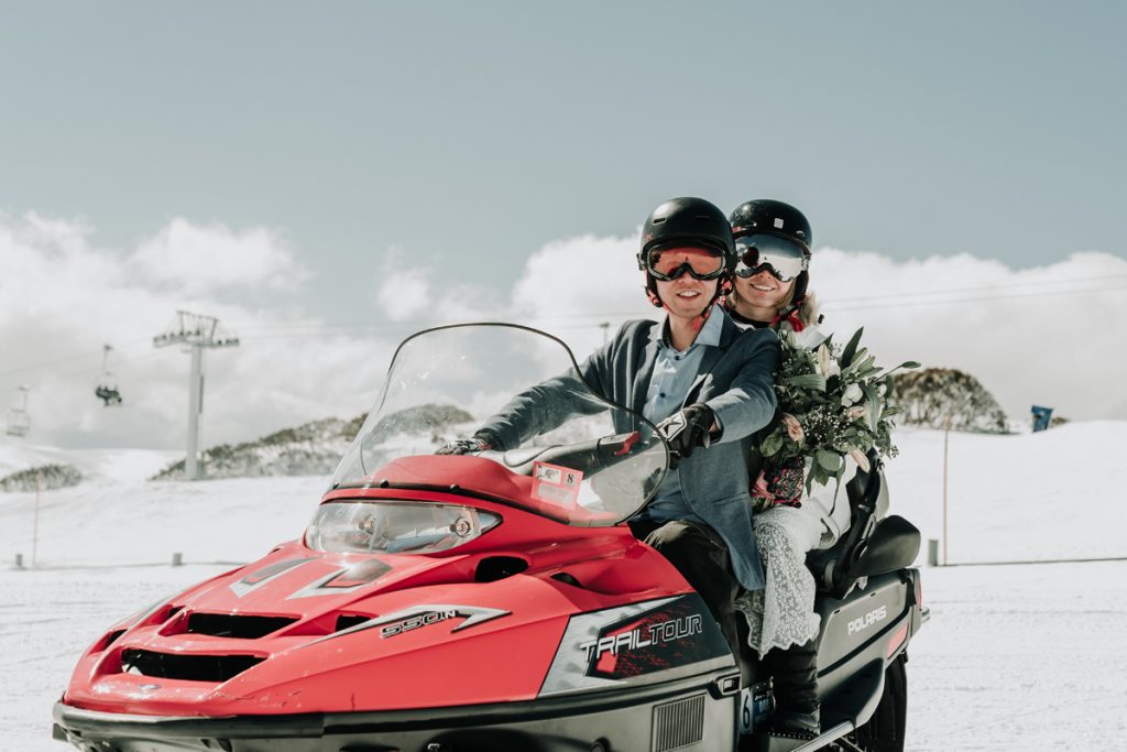 Melbourne couple on snow mobil for snow engagement photos shoot Australia