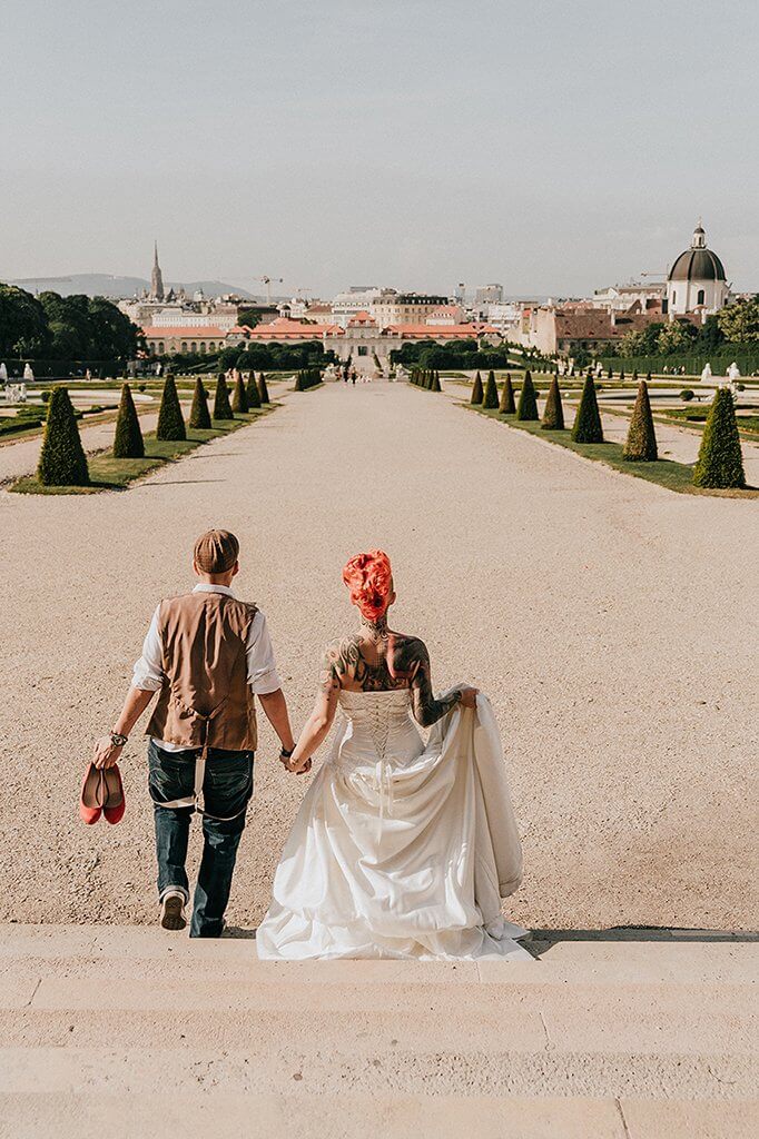 Destination wedding in Vienna showing tattooed same sex lesbian bride and bride taken by Lowina Blackman from Black Avenue Productions in Europe