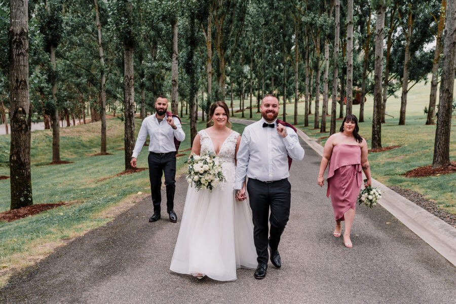 samantha and justin in their winery wedding with maid of honour and best man