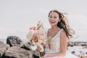 Beautiful asian bride by the sea in a city theme wedding in melbourne shot by black avenue productions