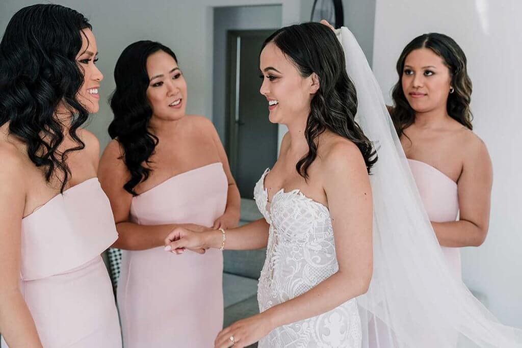 bride getting ready with bridesmaids for meadowbank estate wedding shot by Black Avenue Productions