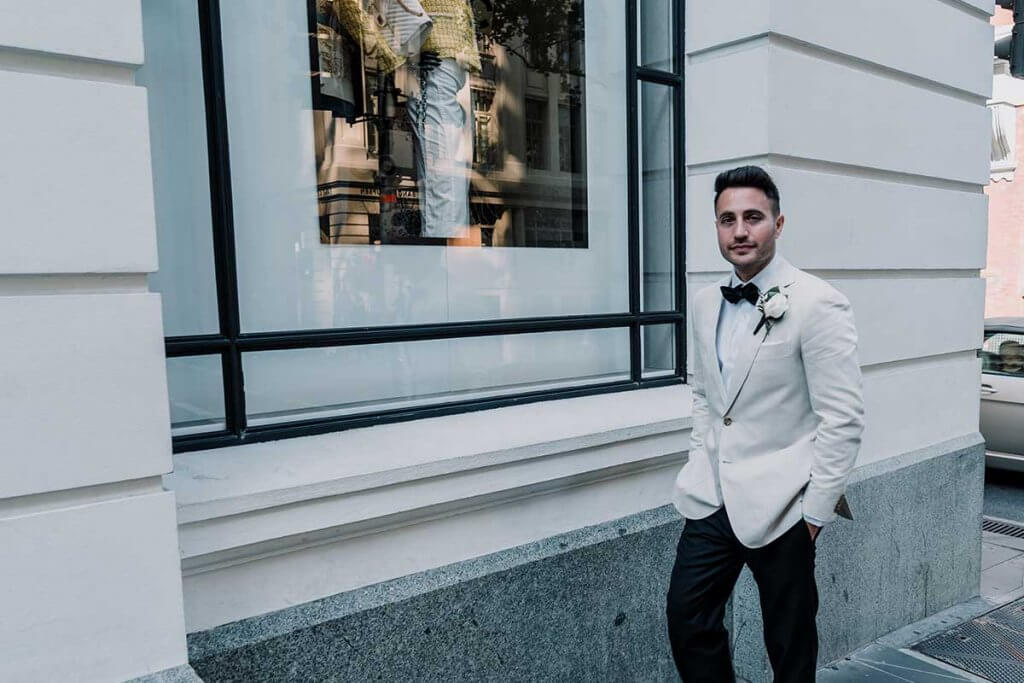 wedding groom in awesome elegant white suit shot by Black Avenue Productions