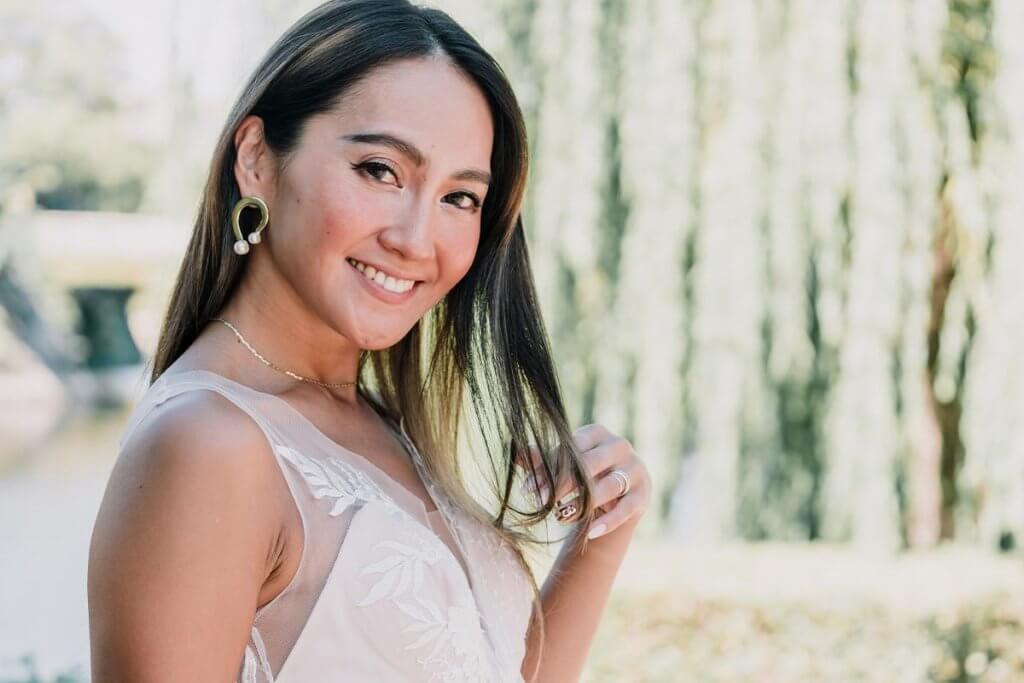Asian gorgeous model in white wedding dress outdoor shoot