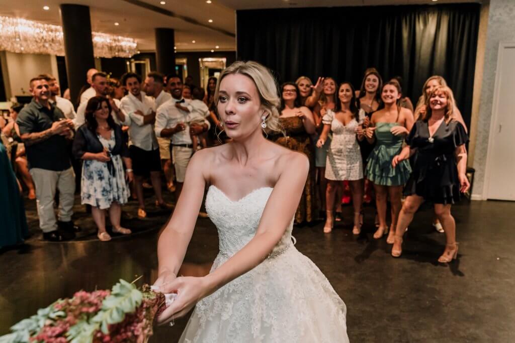 bride ready and about to throw the bouquet. captured by black avenue productions