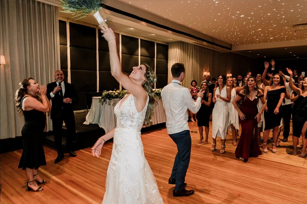 bride tossing the bouquet. captured by black avenue productions