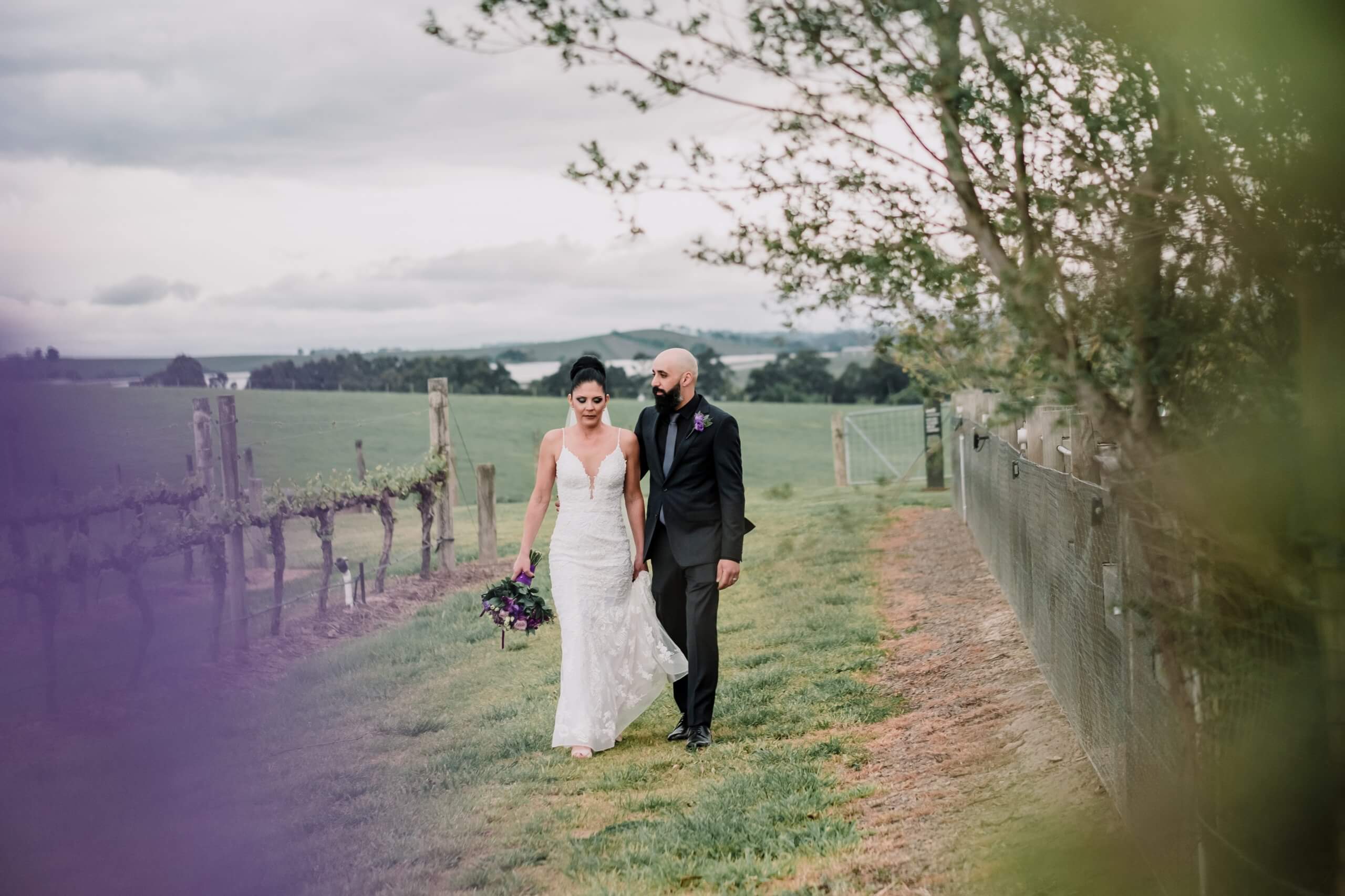 Beautiful couple in a beautiful rustic field makes for a perfect wedding shoot location, captured by Black Avenue Productions