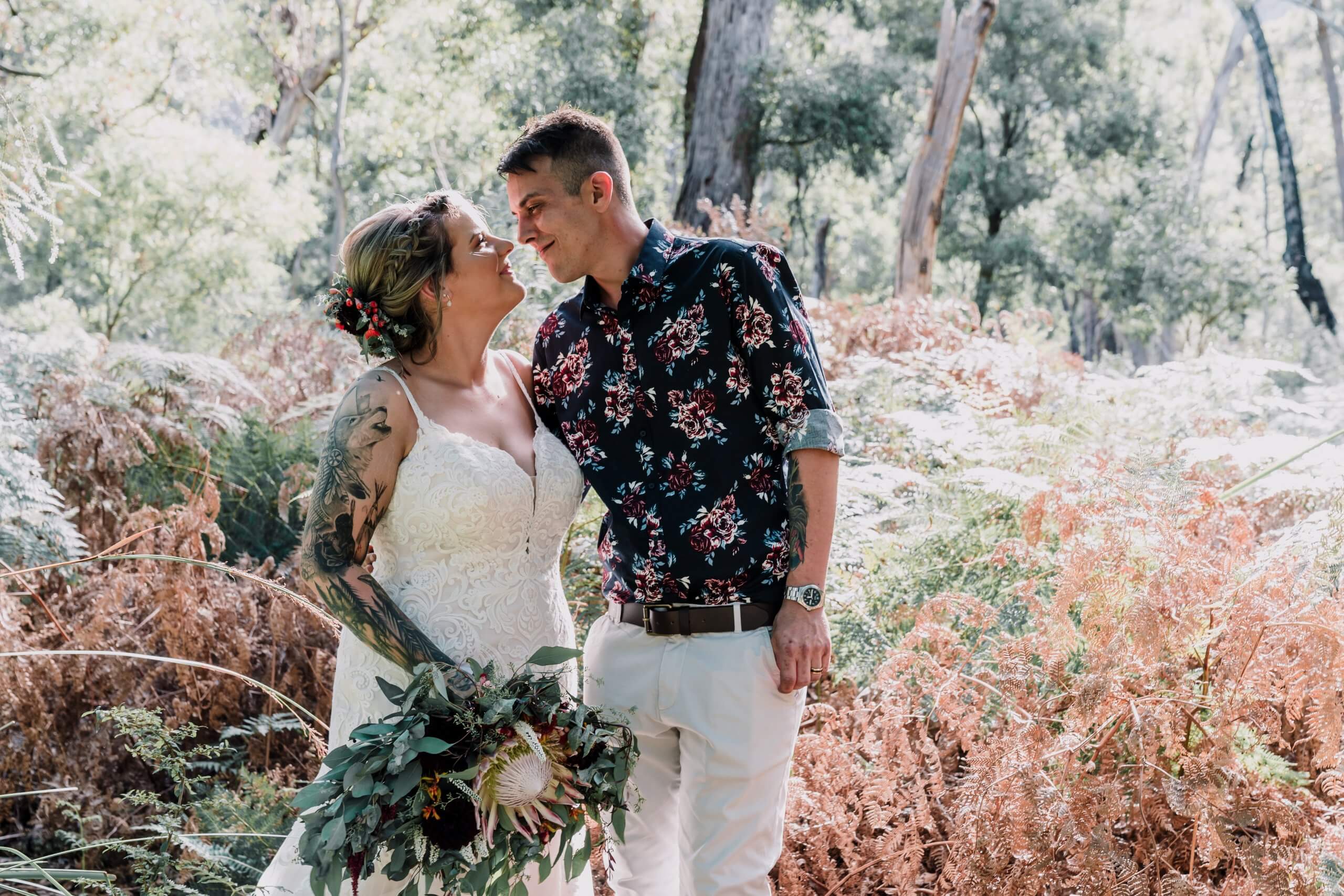 Newlyweds looking in love while holding each other in this beautiful location in the halls gap, captured by Black Avenue Productions