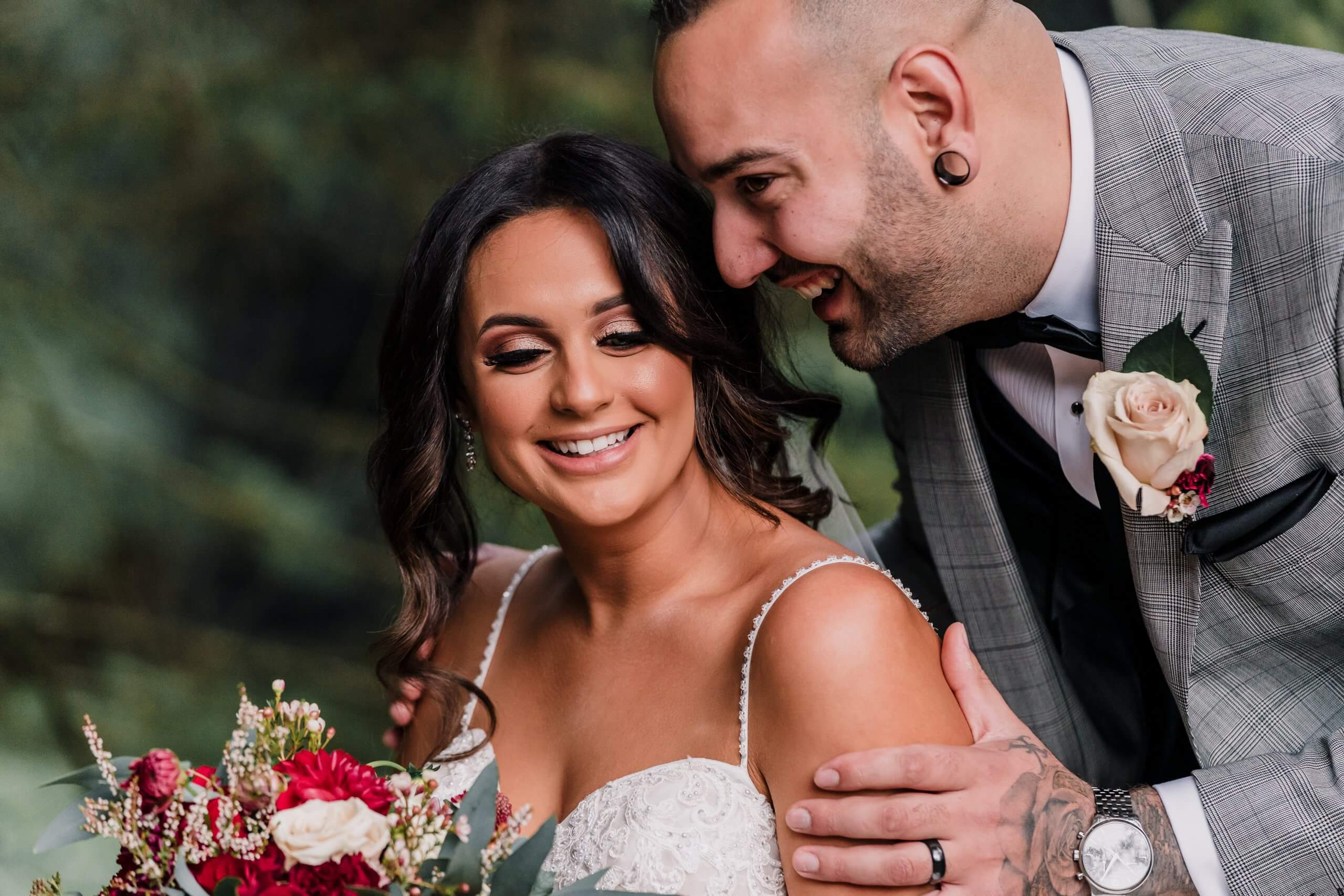 Bride and groom happily smiling in this candid shot, captured by Black Avenue Productions