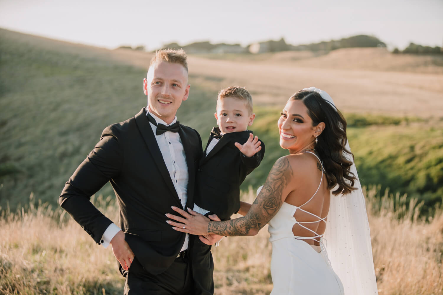 A beautiful shot of the bride and groom with their baby boy, captured by Black Avenue Production