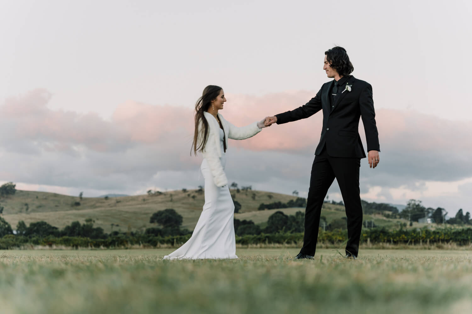 Engagement Shoot Mistakes To Avoid, Beautiful shot of the couple by the hill in the vineryCaptured by Black Avenue Productions