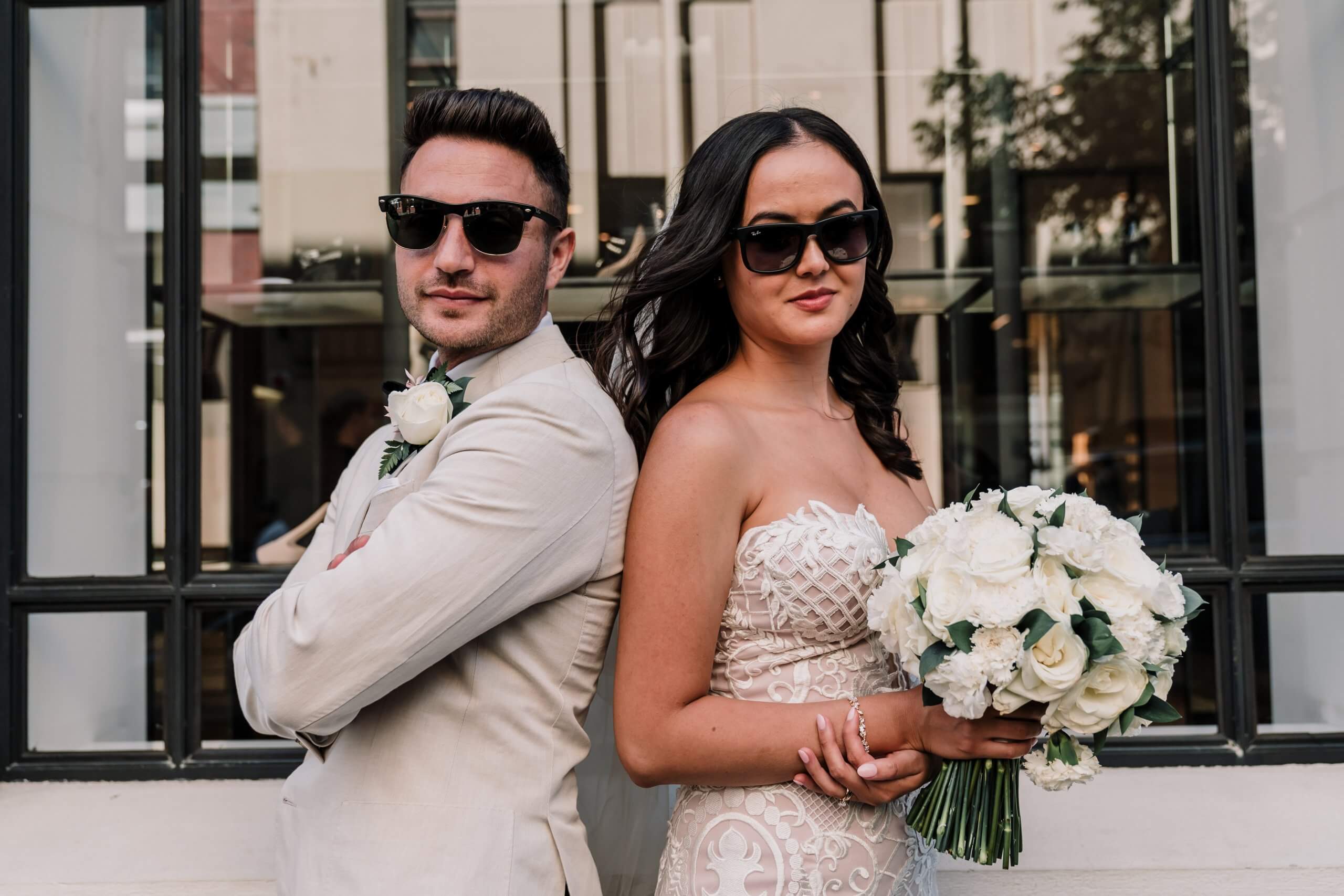 couple does a cool pose with sunglasses on, Captured by Black Avenue Productions