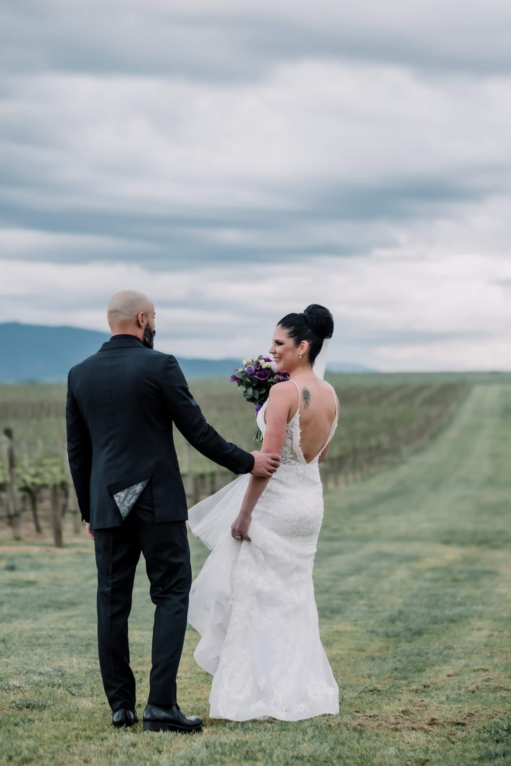 Wedding Shoot Interrupted by bad weather, a beautiful shot of the couple with the hills as and the gloomy sky as their background, captured by black avenue productions