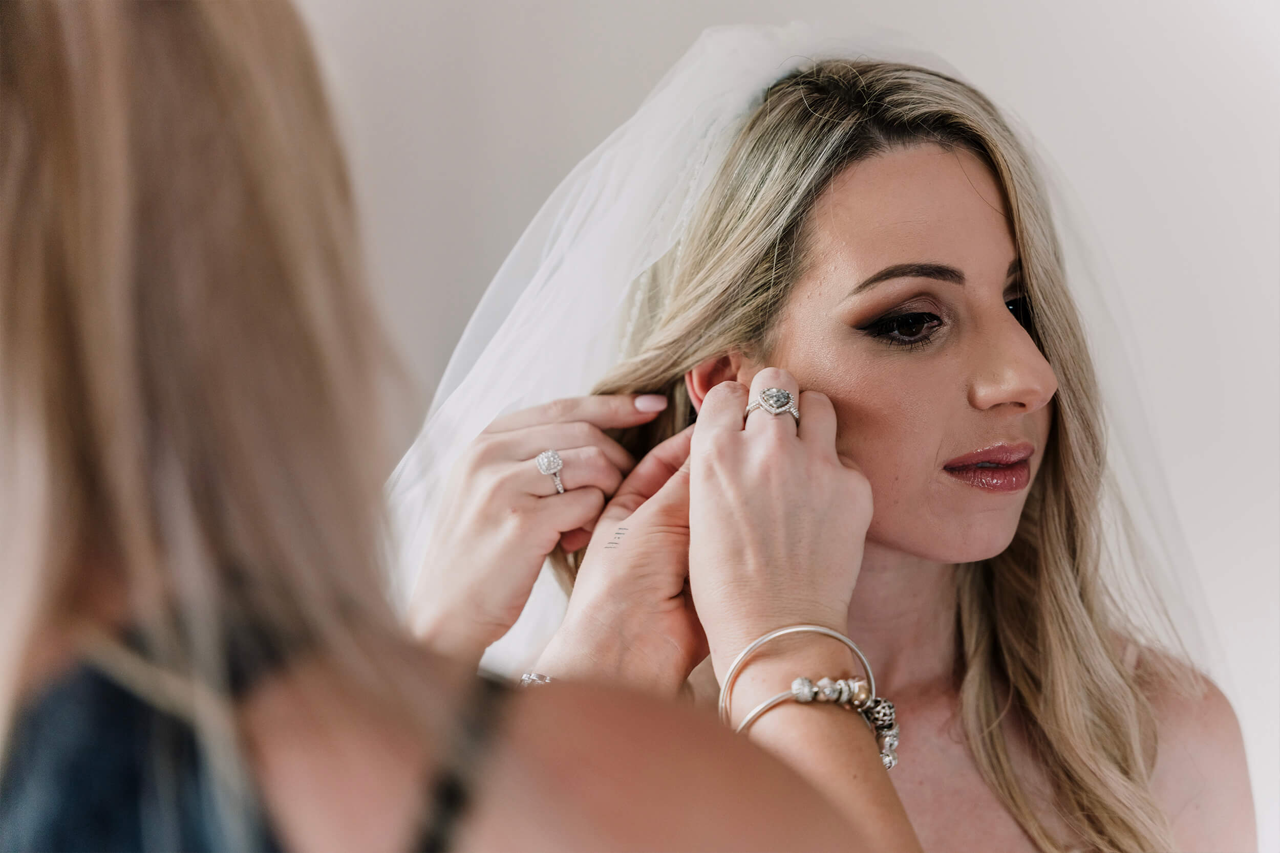 Engagement Shoot Preparations the lovely bride wearing her jewelry, captured by Black Avenue Productions