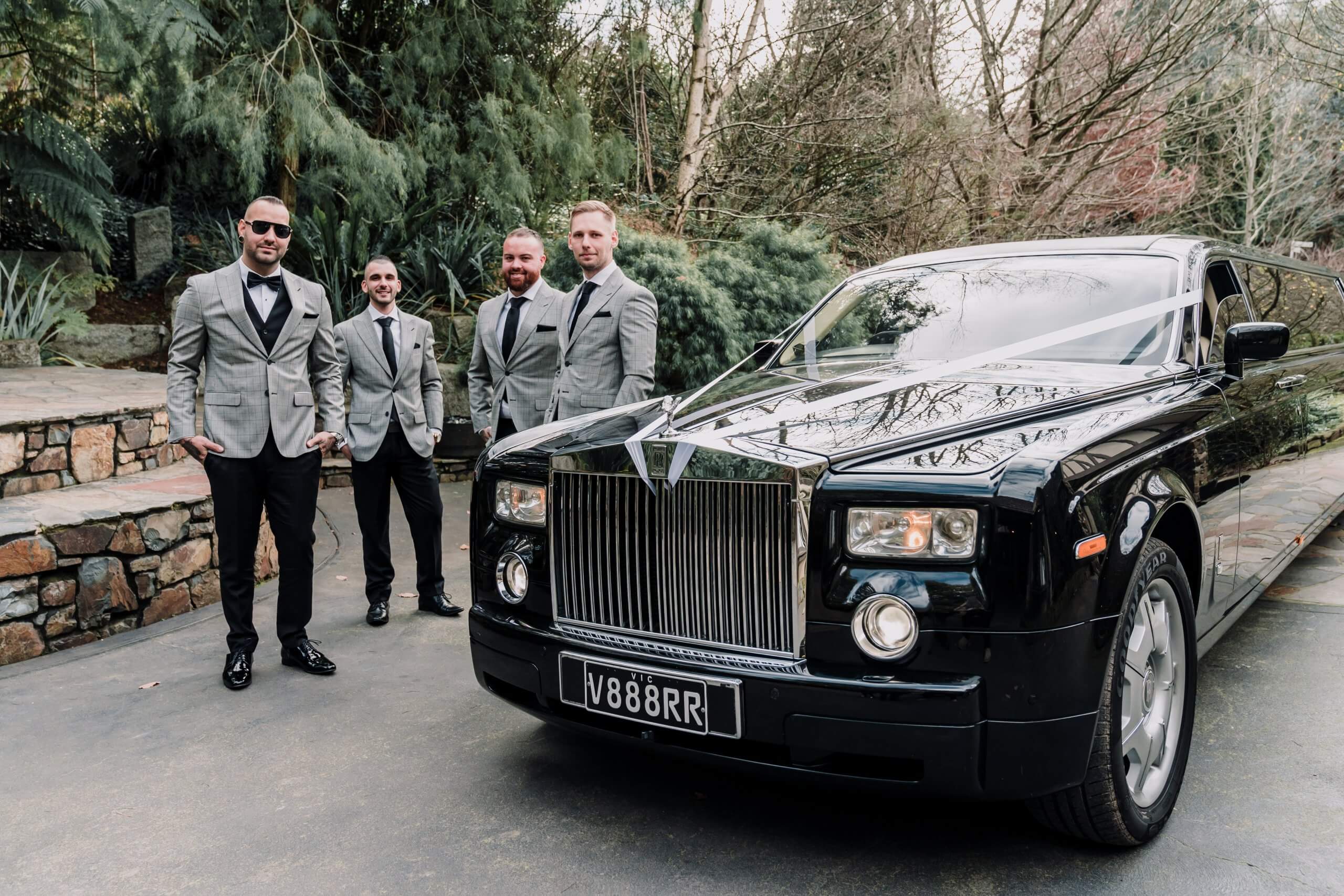 Groomsquad looking dashing beside the black limousine. Captured by Black Avenue Productions