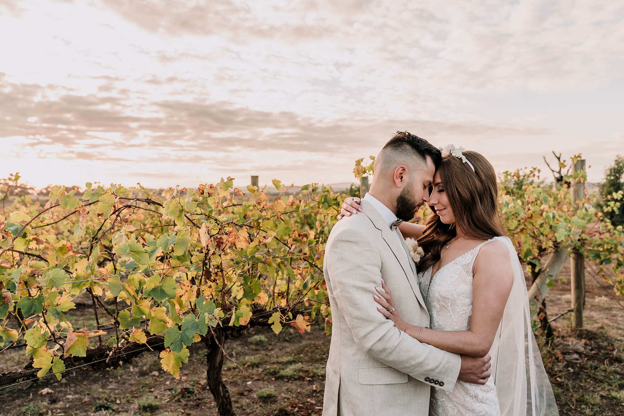 Engagement Photo Ideas, lovely couple holds each other by the vineyard by Black Avenue Productions