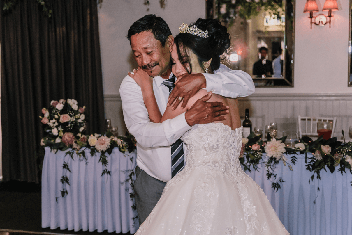 Bride and her father emotionally hugs during their dance.