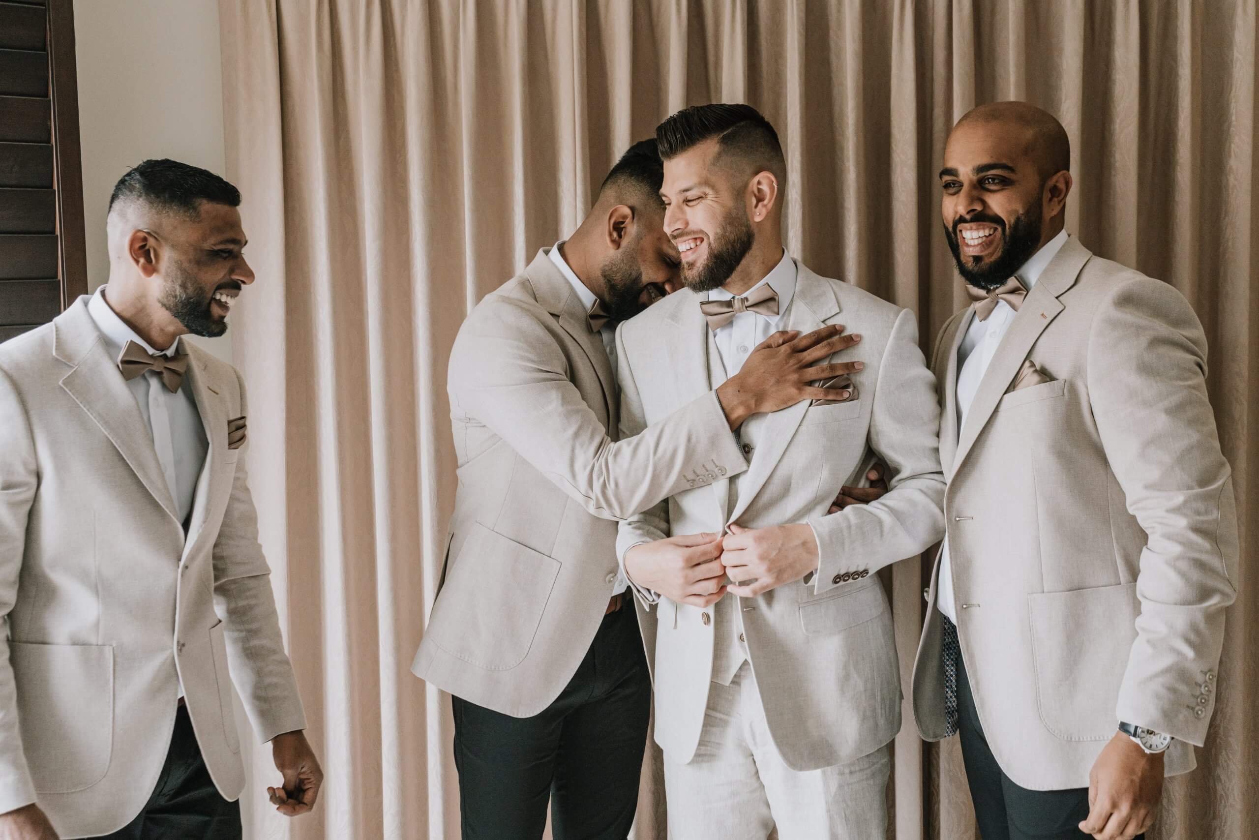 A photo showing the closeness of the groom and his groomsmen as they are having fun during the groom's get ready session.