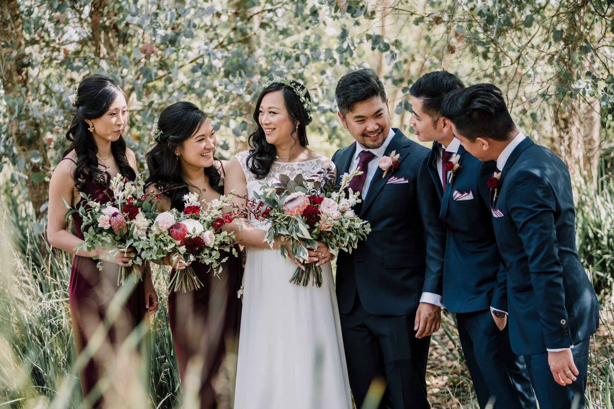 Closeup and Candid shot of the Bridal Party while they are standing in the middle of a garden