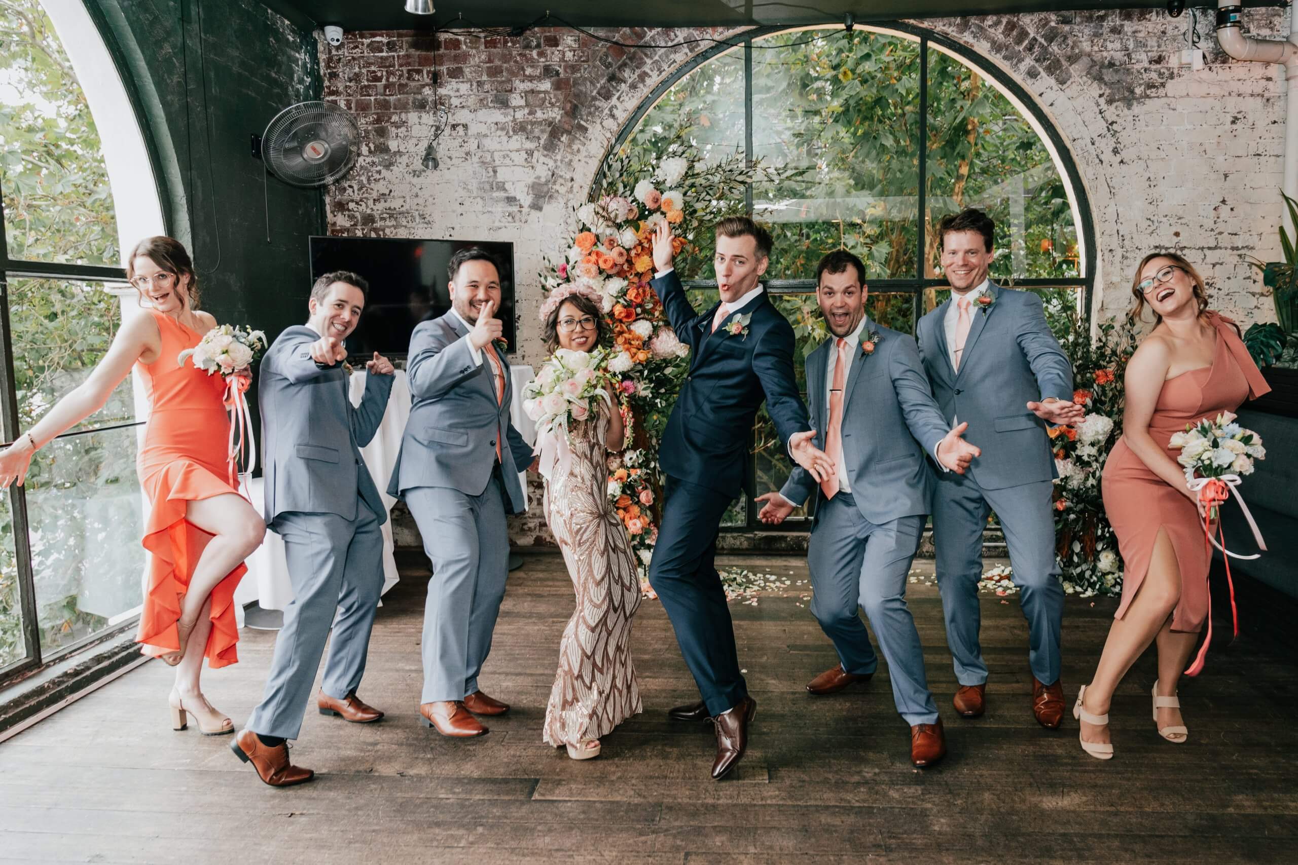 Fun photo of the bridal party as they pose with wacky faces.