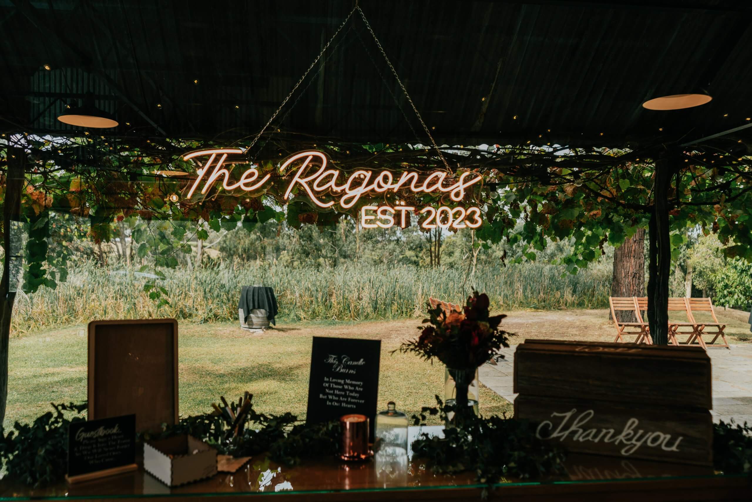 Customise Your Wedding - 'The Ragonas est 2023' sign and rustic details for a wedding.