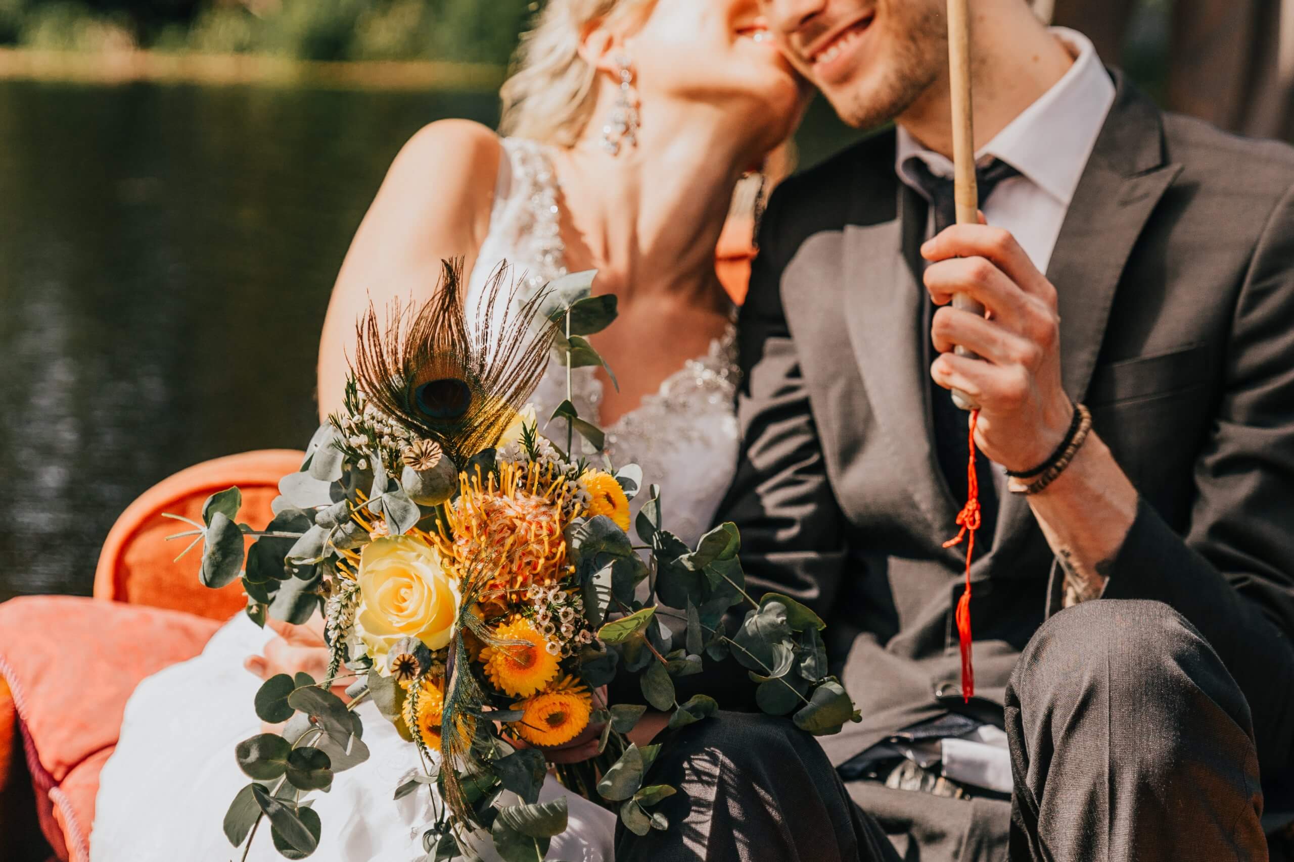 Narrative Portraiture - The bride and groom on a boat with flowers