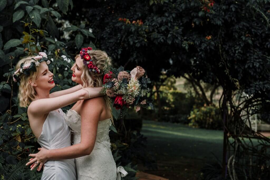 lesbian brides embracing each other