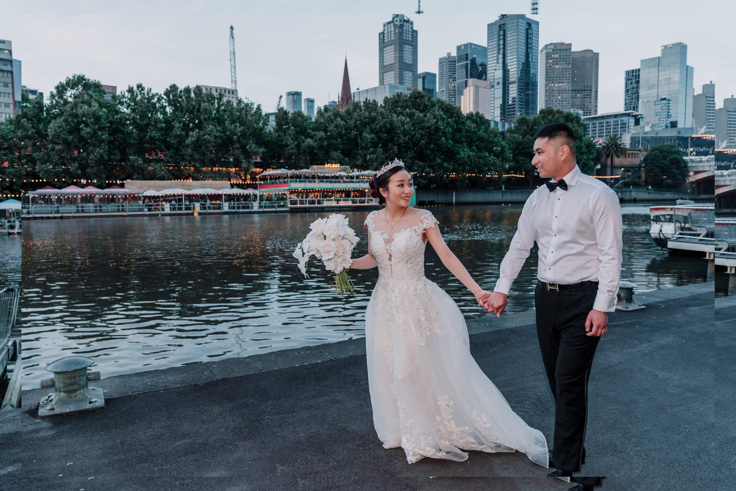 Bride and groom walking side by side and holding hands at Metropolis Events