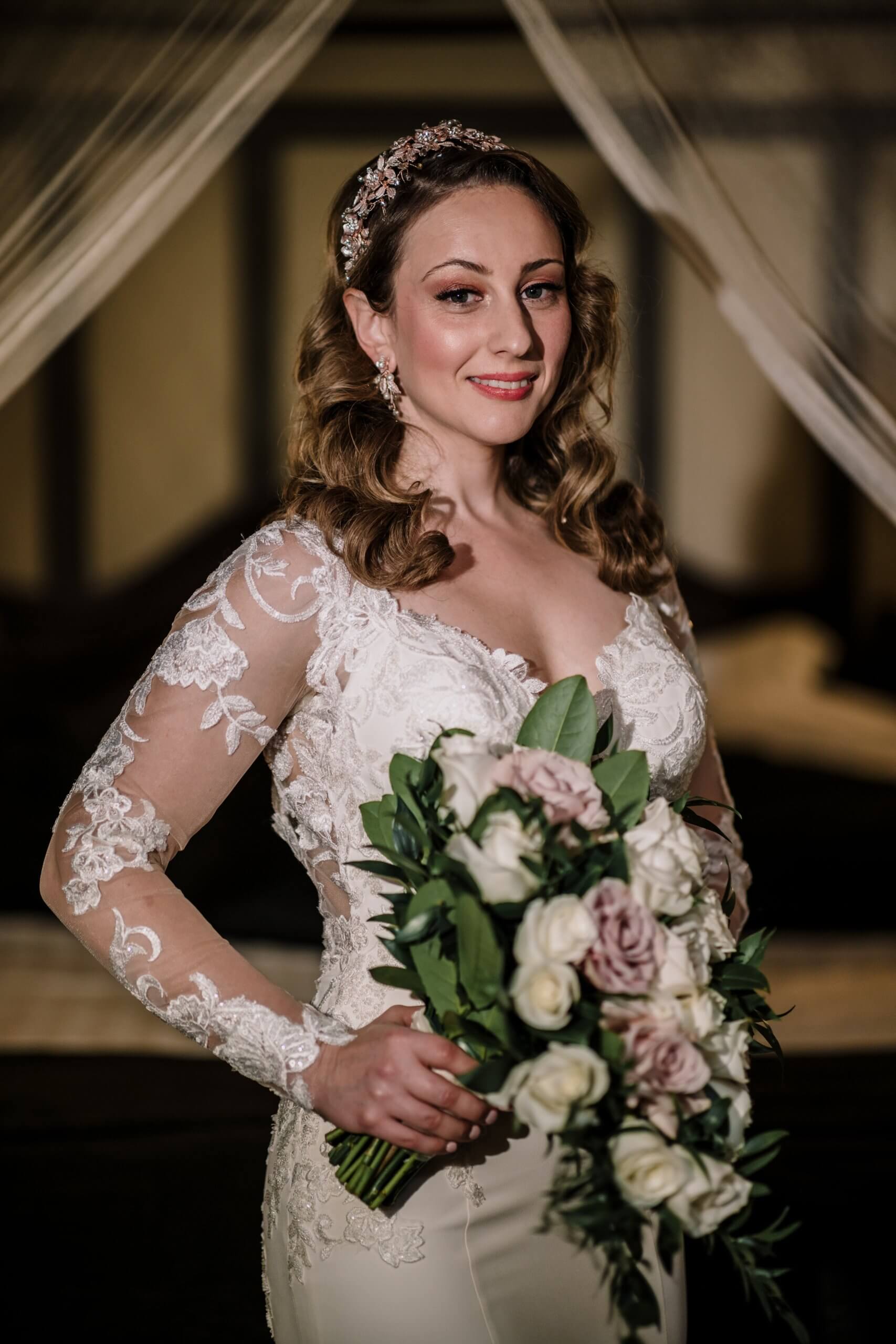 The bride posing in the timber chapel of Nathania Springs