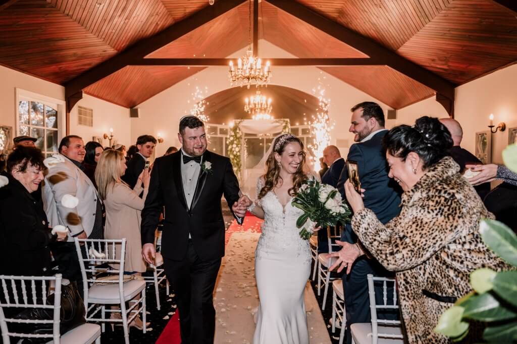 The bride and groom walking down the aisle at Nathania Springs after the ceremony