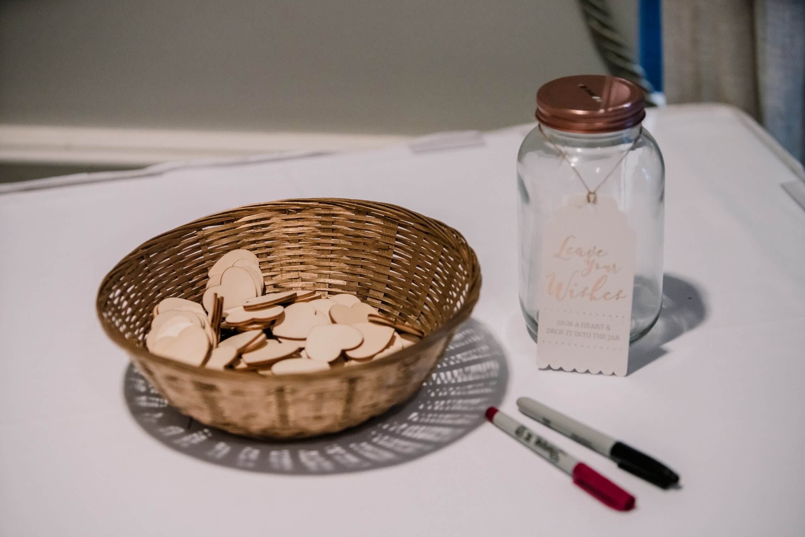 Detail shot of wooden hearts with markers