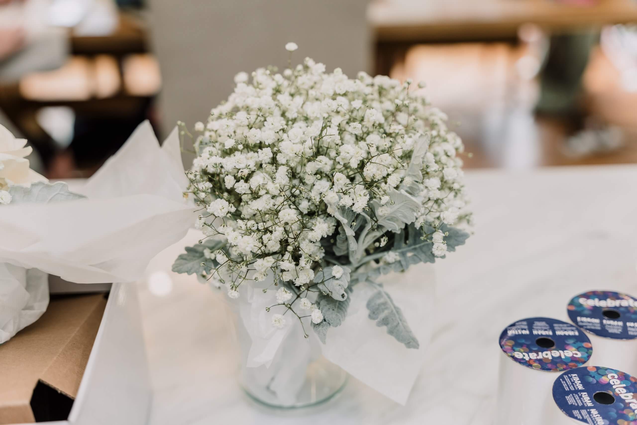 Detail shot of a bouquet of tiny white flowers