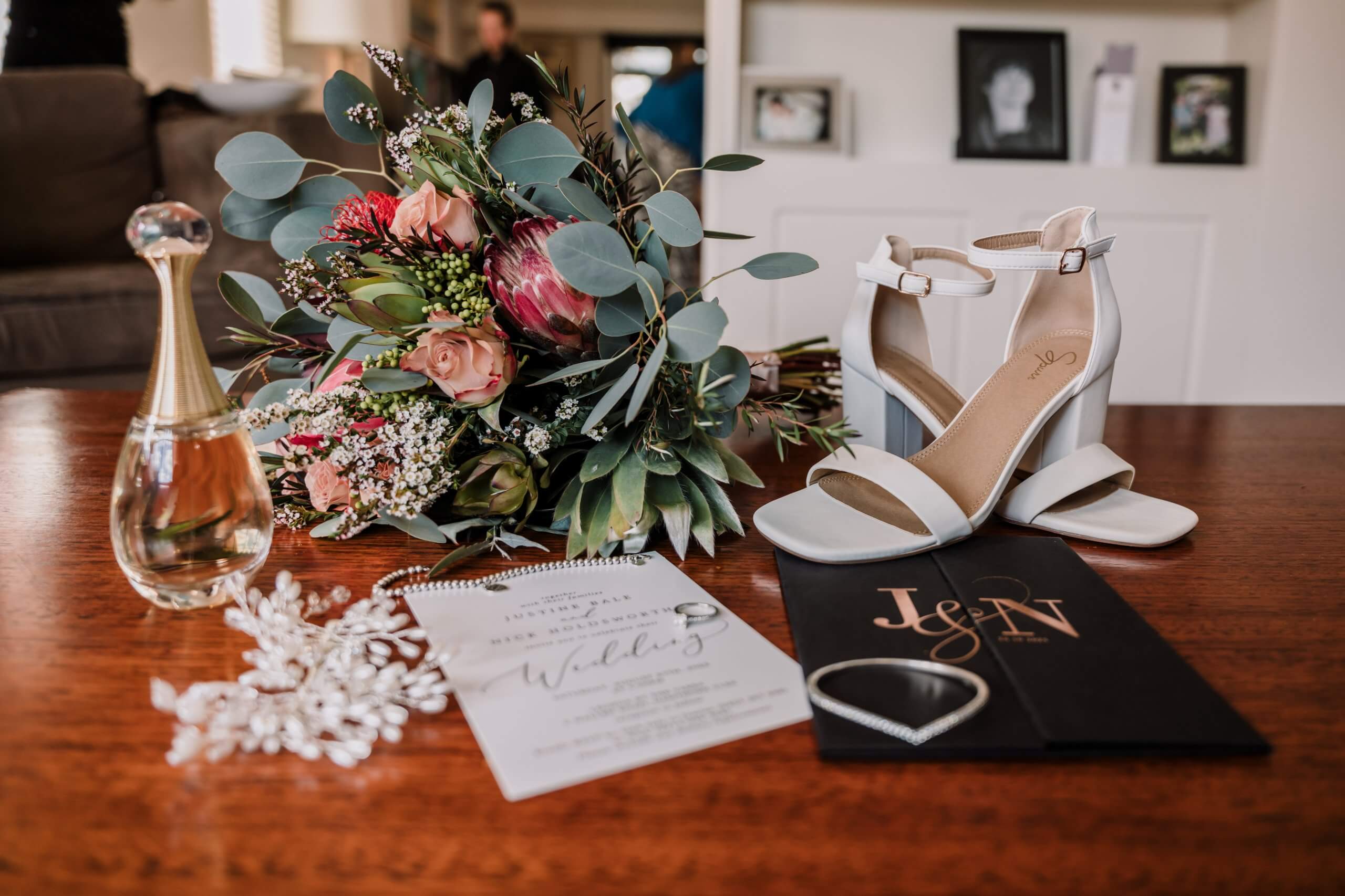 Detail shots of a bride's flowers, accessories, shoes and wedding invitations