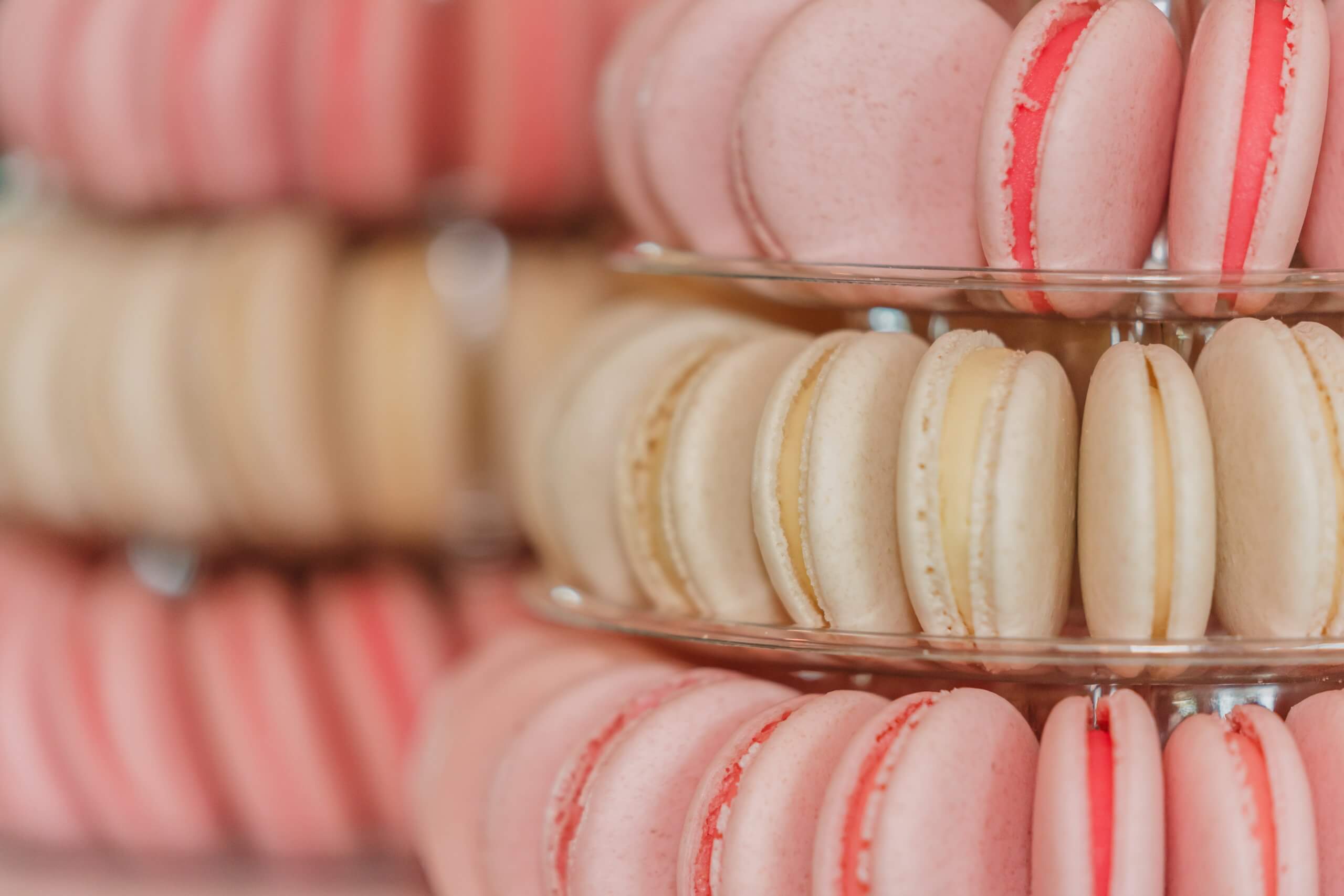 Detail shots of pink and cream French macarons