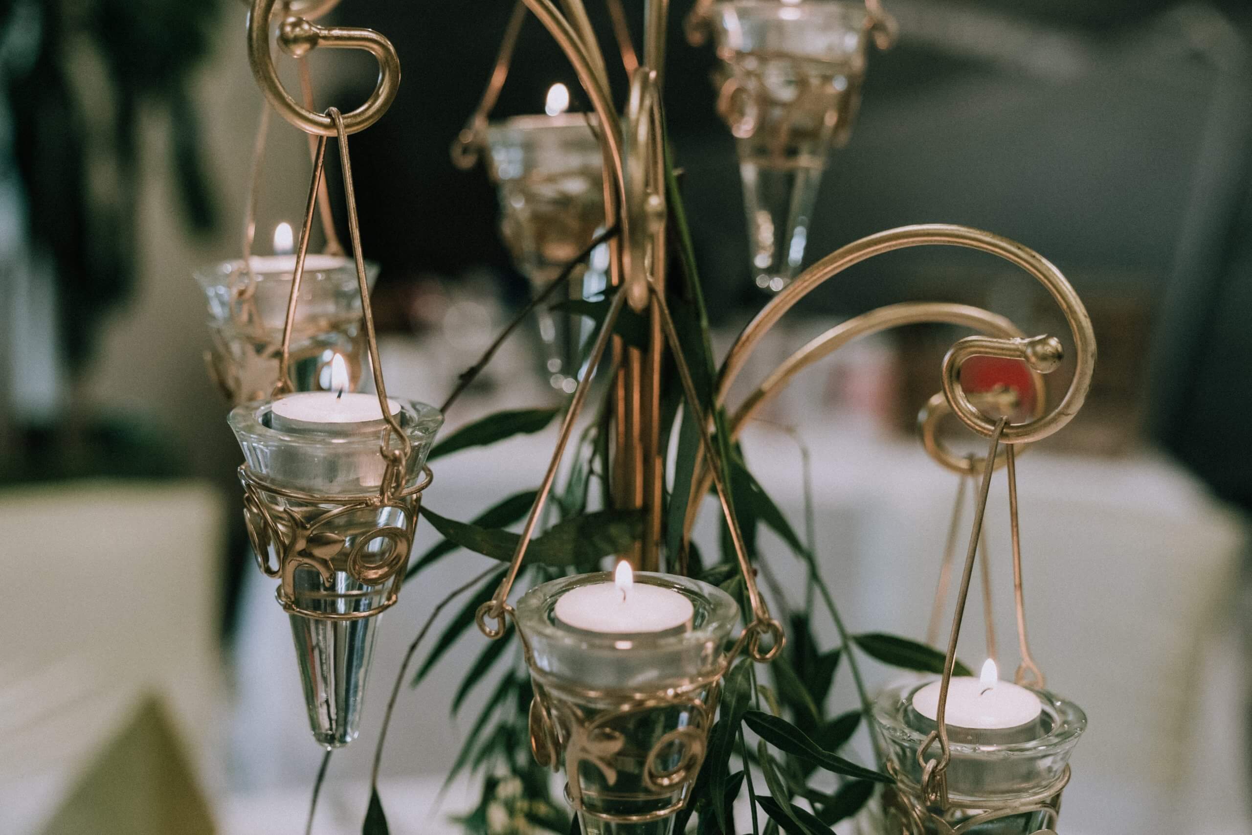 Detail shots of a brass fixture with candles